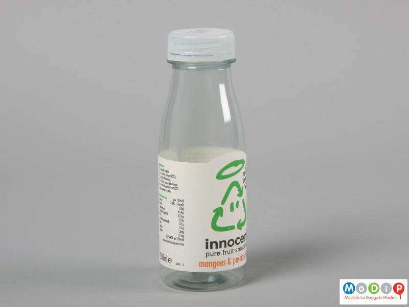 Side view of an Innocent Smoothie bottle showing the position of the paper label on the bottle.