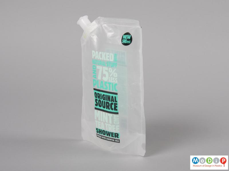 Side view of a shower gel packet showing the thinness of the packet.
