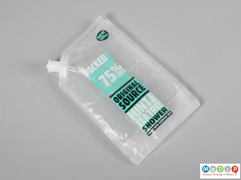 Front view of a shower gel packet showing it flat.