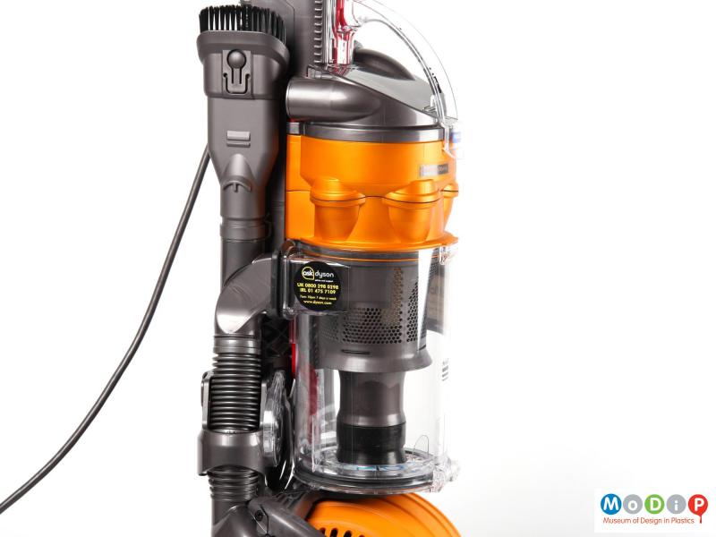 Close view of a Dyson DC24 All Floors vacuum cleaner showing the clear collection chamber.