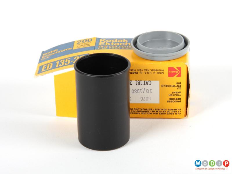 Side view of film packaging showing the canister, with the lid removed, and the box.