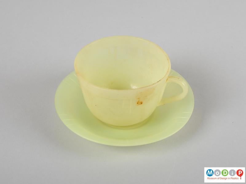 Top view of a cup and saucer showing the lined decoration.