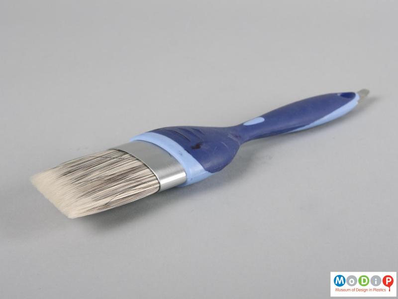 Side view of a paint brush showing the shaped bristles.
