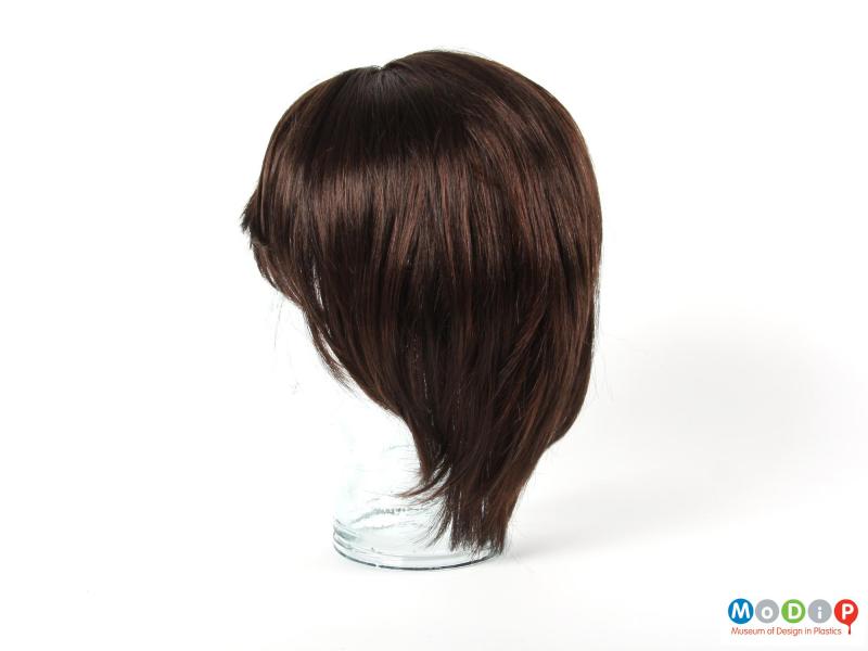 Side view of a wig showing the shaping around the back of the head.