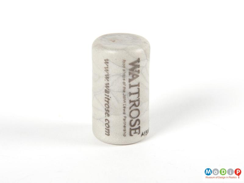 Side view of a cork showing the rounded top and bottom edges.