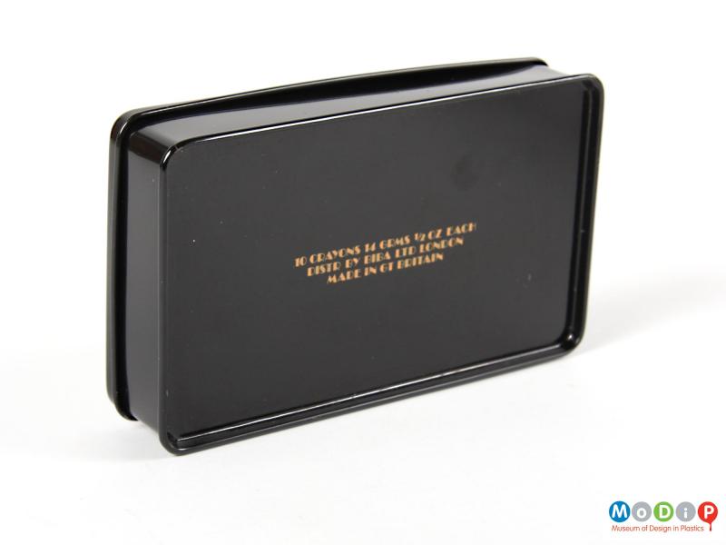 Underside view of a make-up box showing the text on the base.