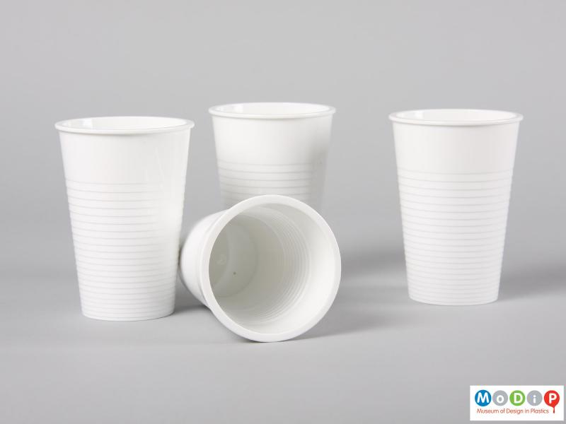 Side view of a set of Water tumblers showing one beaker on its side exposing the inside surface.