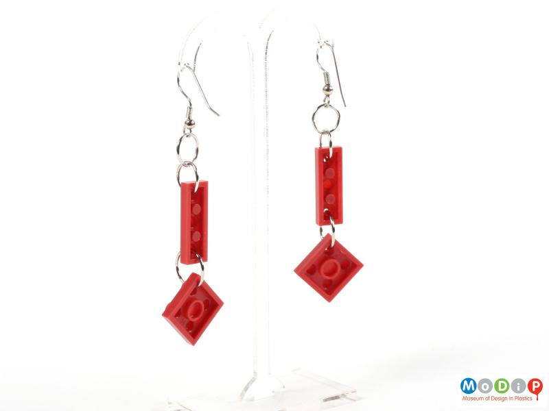 Rear view of a pair of earrings made of Lego showing the ear hooks.