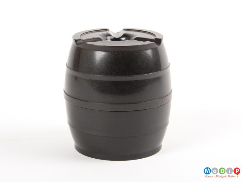Side view of an ashtray showing the barrel shape.