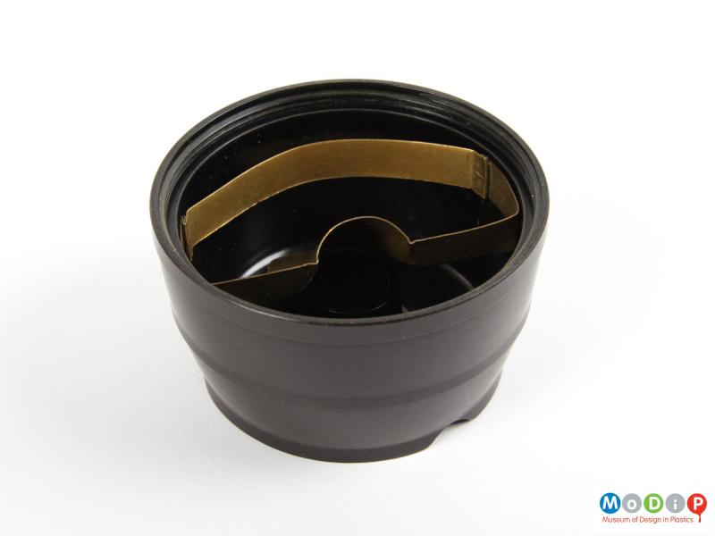 Inside view of an ashtray showing the brass fitting in the base.