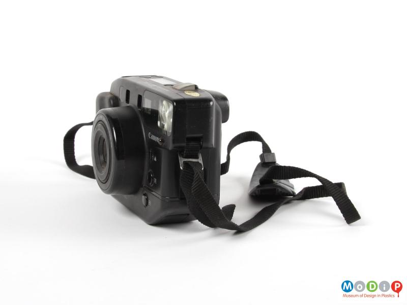 Side view of a camera showing the carrying strap.