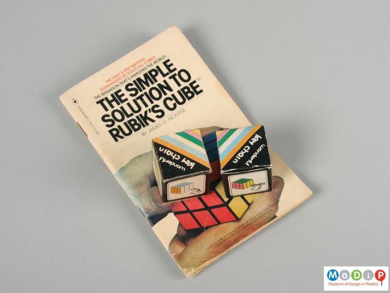 Front view of a book showing it with the packaging for the cubes.