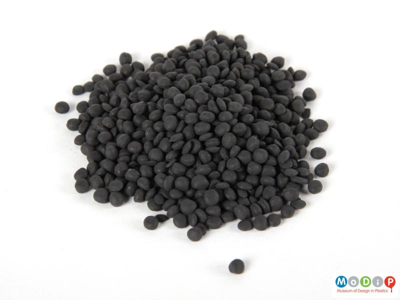 Top view of a pile of pellets showing the all black sample.