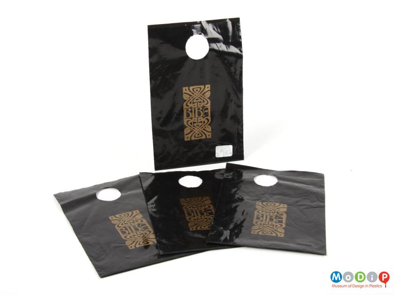 Side view of a Biba carrier bag showing the printed logo and round handles.