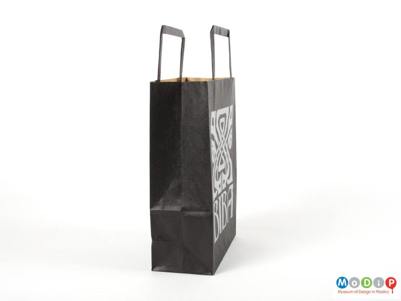 Side view of a paper carrier bag showing the folding gusset.