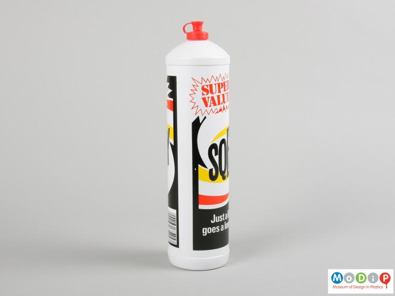 Side view of a Sqezy bottle showing the printed design.