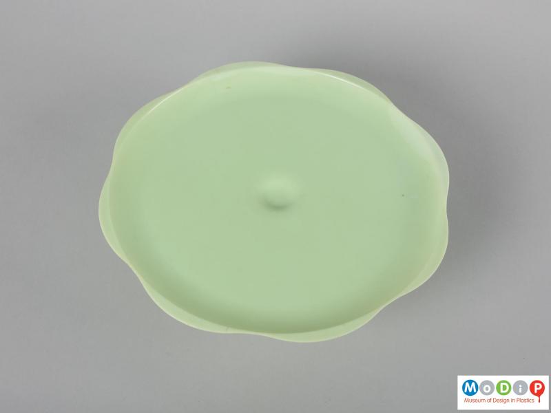 Top view of a cake stand showing the wavy edge of the plate.
