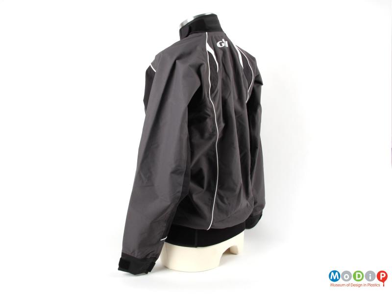 Side view of a sailing smock showing the neoprene waistband.