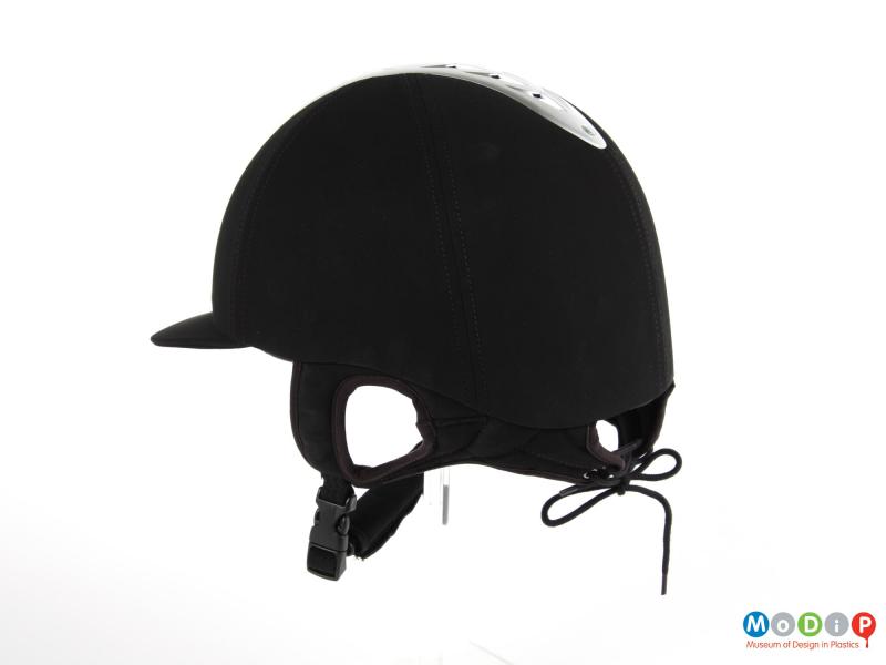 Side view of a riding hat showing the laced closure on the back.