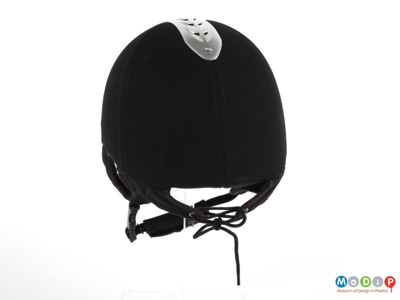 Rear view of a riding hat showing the laced closure on the back.