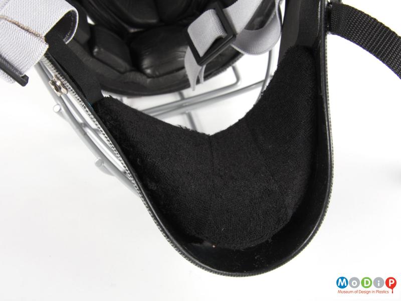 Close view of a hockey helmet showing the chin pad.