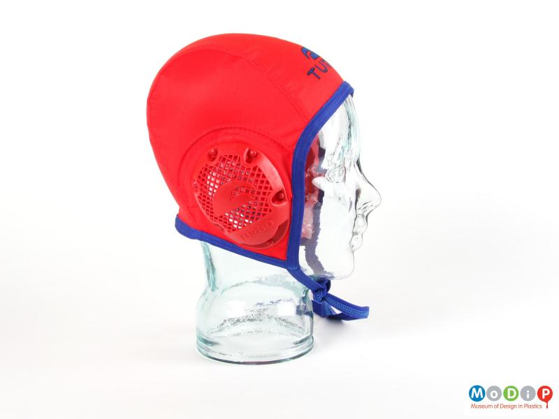 Side view of a water polo cap showing the ear protector.