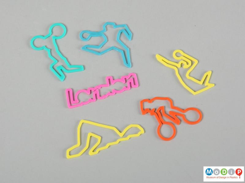 Side view of a group of elastic bands showing the different shapes.