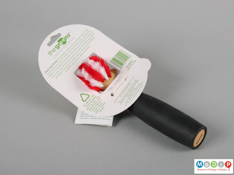 Rear view of a dish brush showing the packaging.