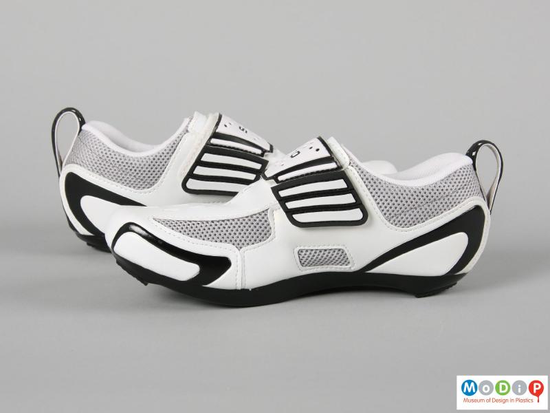 Side view of a pair of triathlon shoes showing the shaped sole.
