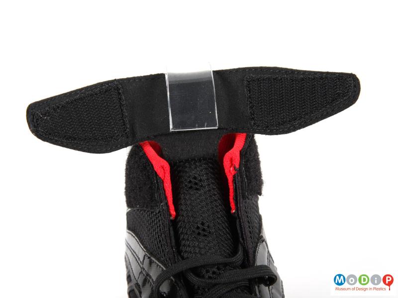 Close view of a pair of wrestling shoes showing the velcro at the top of the tongue.