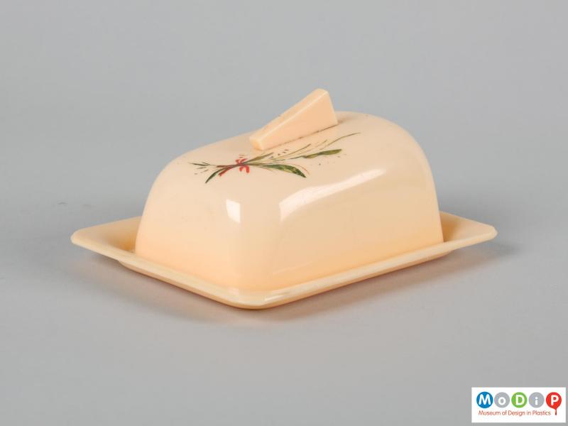 Side view of a butter dish showing the rounded shape of the cover.