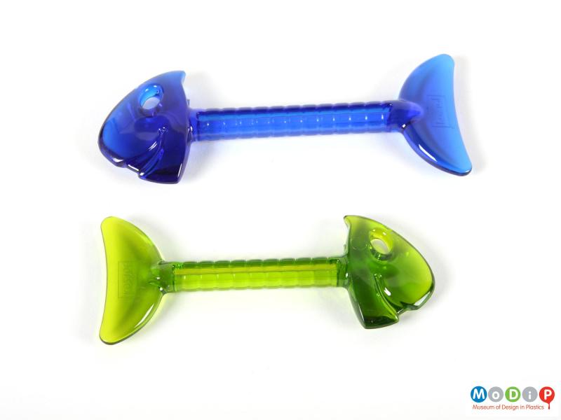 Side view of a pair of tube squeezers showing the two colours.