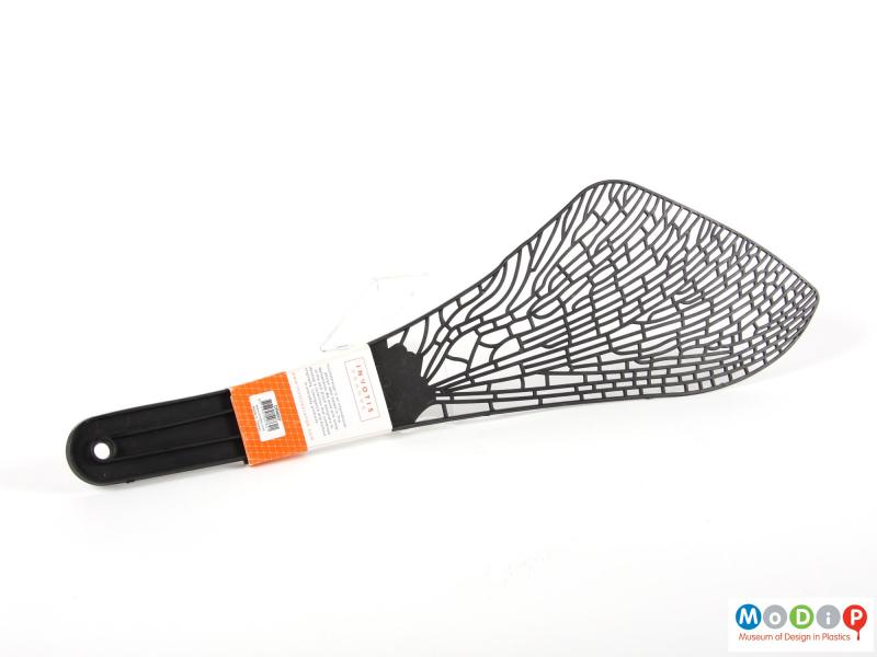 Side view of a fly swat showing the packaging.