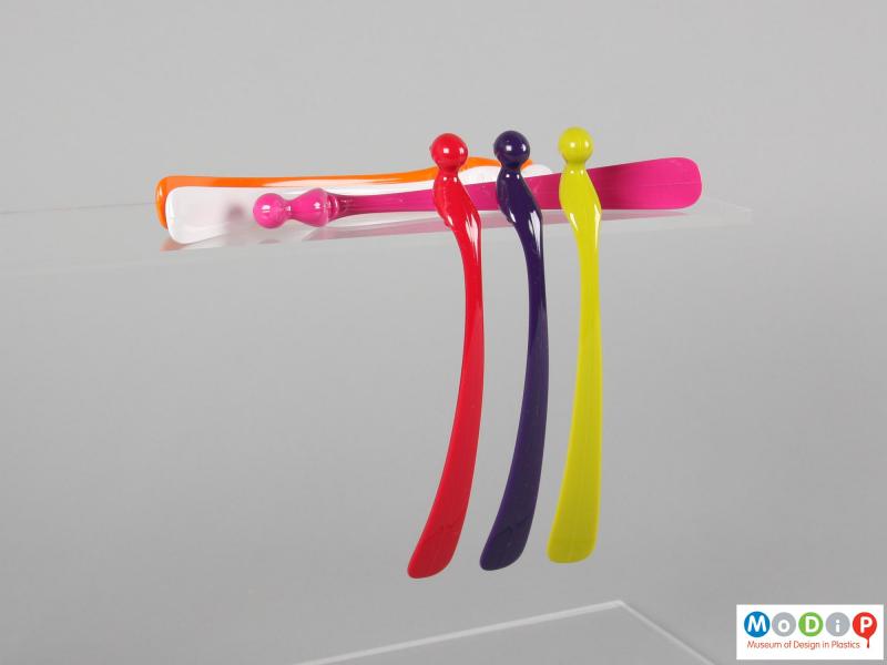 Side view of a set of cocktail stirrers showing the tapering tail.