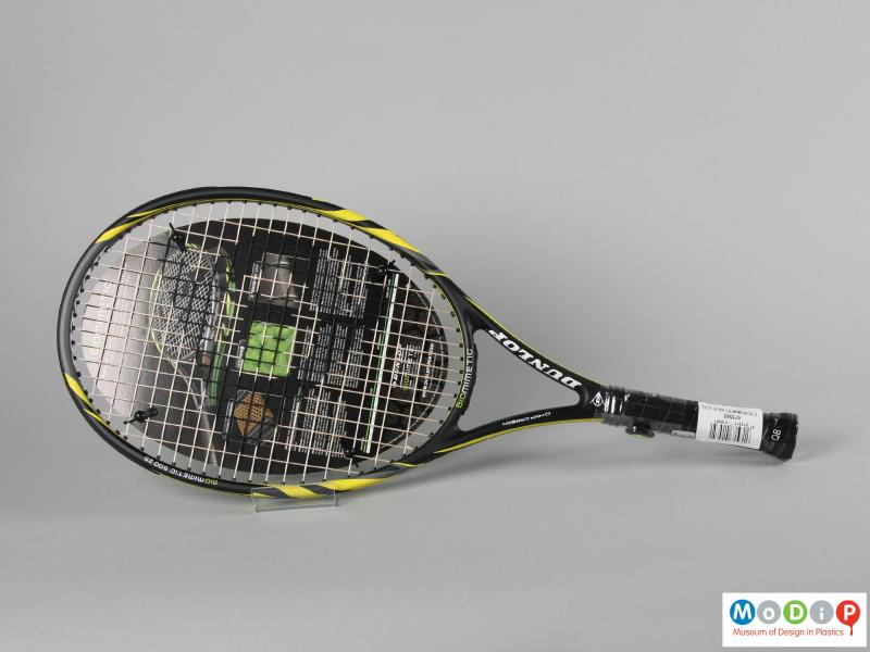 Side view of a tennis racket showing