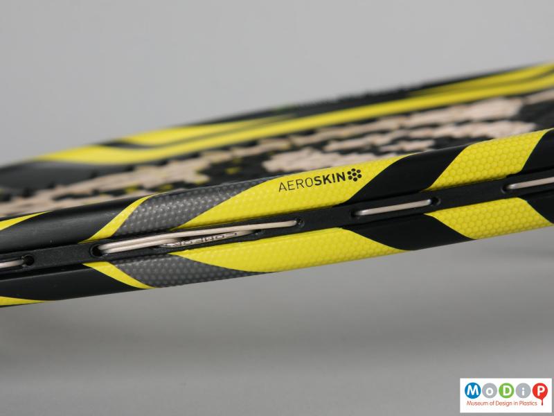 Close view of a tennis racket showing the frame.