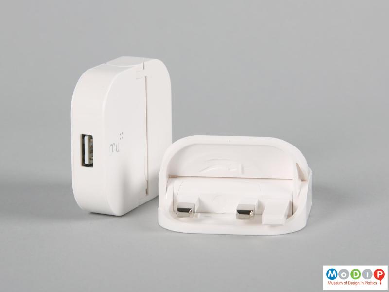 Side view of two plugs showing one half closed and one folded close.