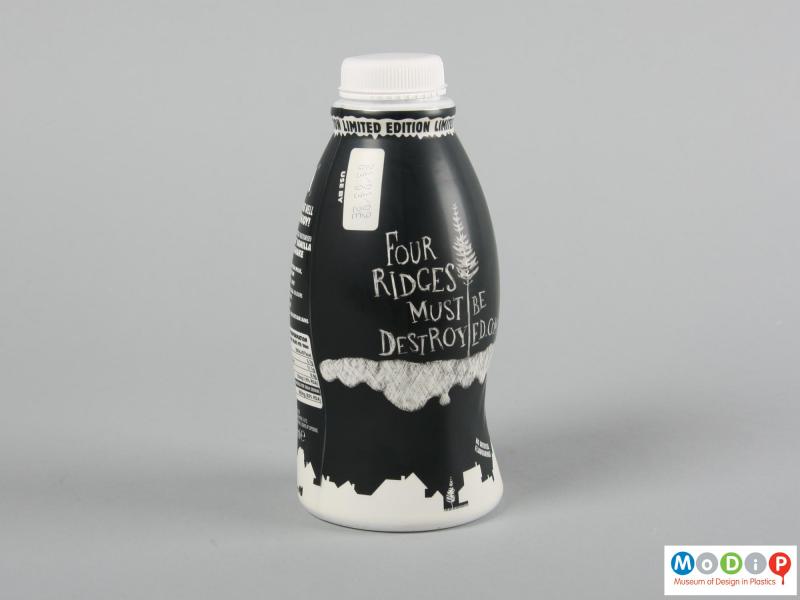 Side view of a bottle showing the black and white decoration.