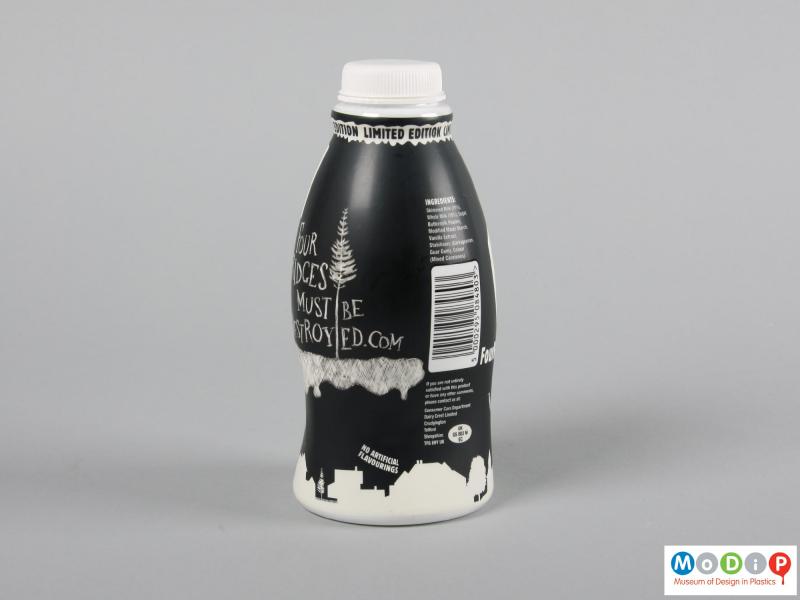 Side view of a bottle showing the black and white decoration.