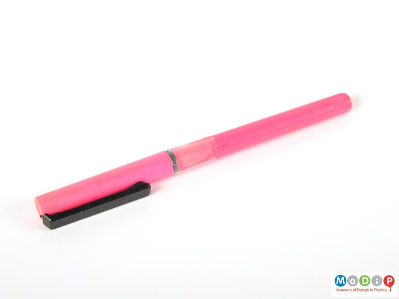 Side view of a pen showing the pink barrel.