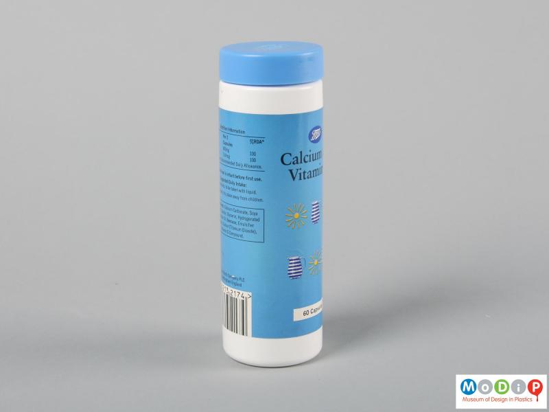Side view of a supplements bottle showing the cylindrical shape.