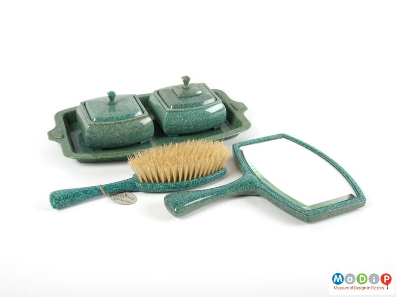 Side view of a brush showing the dressing table set.