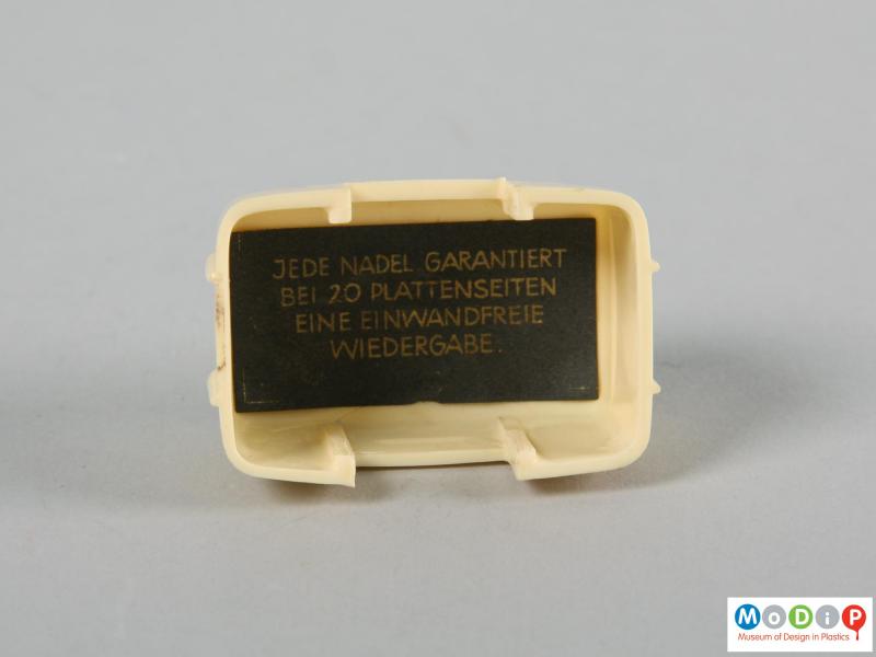 Internal view of a stylus holder showing the printed label.