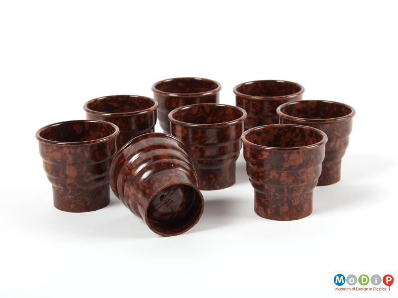 Underside view of a group of 8 egg cups showing the moulded logo in the base.