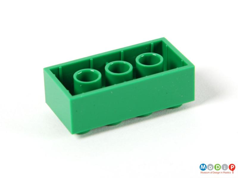Underside view of a Lego brick showing the space for the pegs in the base.