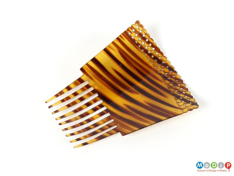 Underside view of a comb showing the rectangular shape.