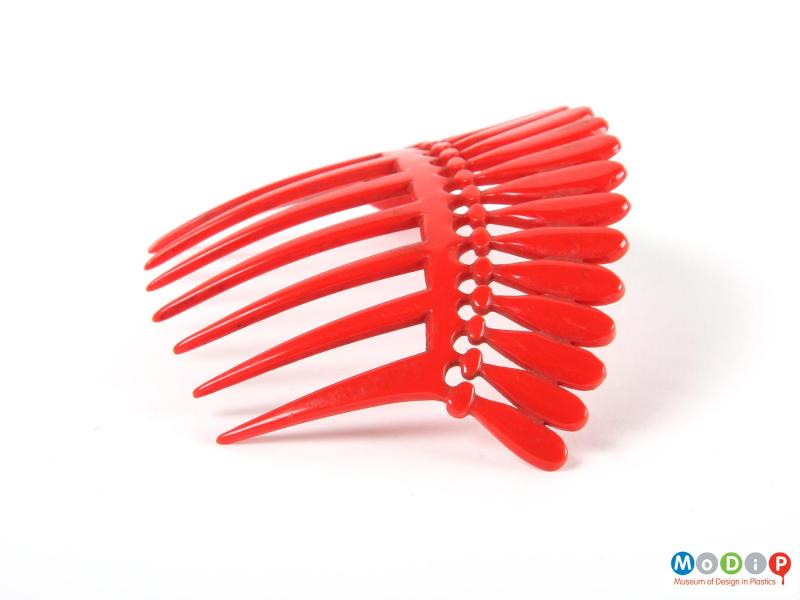 Side view of a comb showing the curved shape.
