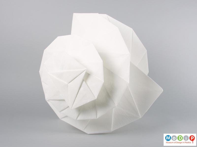 Side view of a lamp showing the turned and folded fabric.