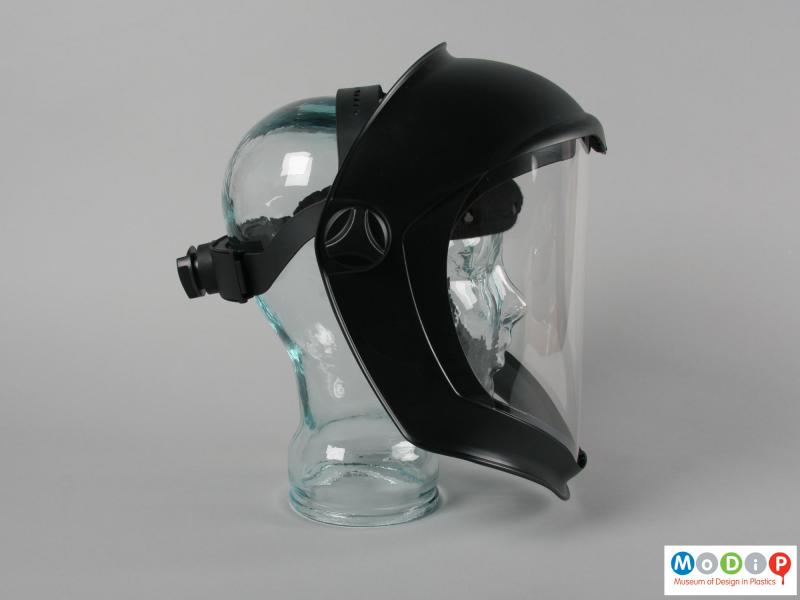Side view of a faceshield showing the fittings.