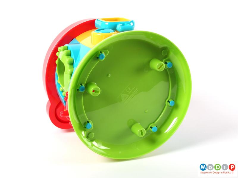 Underside view of an activity toy showing the integral feet.